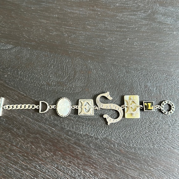 Diesel 925 silver bracelet spelling out diesel. 7” long.